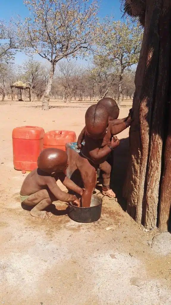 Himba children bathing one another - a show of Ubuntu.